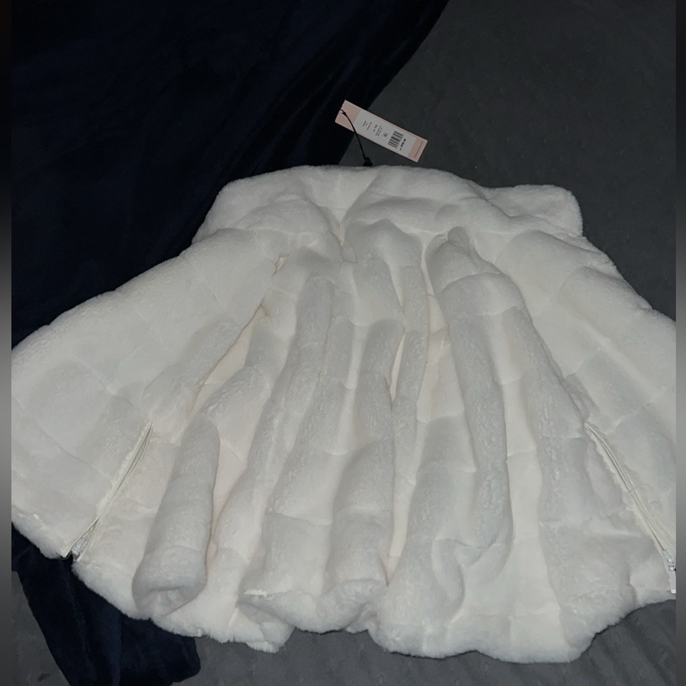 It is white and can be worn for winter.
